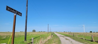 View of dirt / gravel road with a view of rural / 