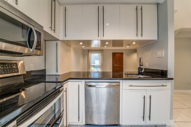 The kitchen features stainless steel appliances an