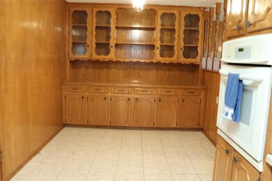 Kitchen breakfast area with light tile flooring, w