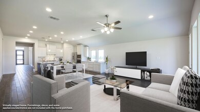Living room with plenty of natural light, a ceili