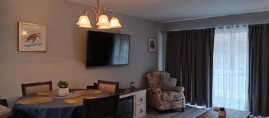 Dining area with hardwood / wood-style floors and 