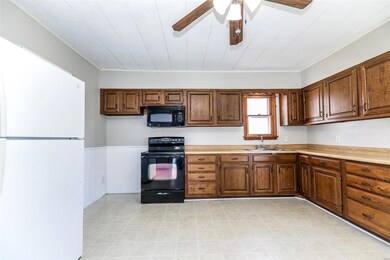Eat in Kitchen with plenty of space for full size dining room table. Newer cabinets and stove/microwave.