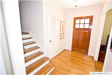 Foyer with beautiful hardwoods throughout.