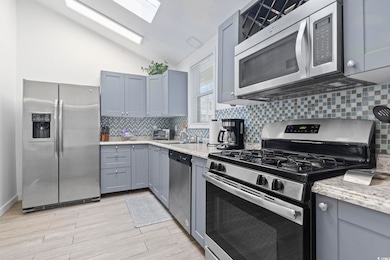 Kitchen featuring appliances with stainless steel 