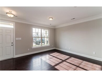 Double window and crown molding in family room.