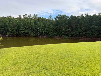 Water view featuring a forest