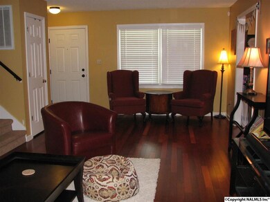 Before paint. Living room from back door. Coat closet to the left and to the right is the dining room or study.