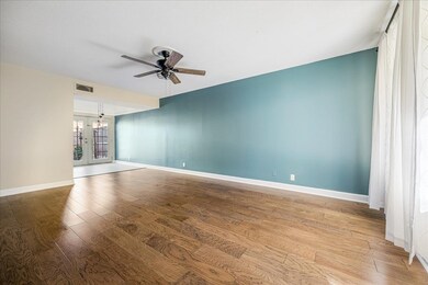 Unfurnished room featuring french doors, light wood-style floors, and ceiling fan