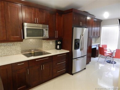 Amazing kitchen remodel with wood cabinetry, quart