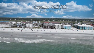 Bird's eye view of waterfront with a beach