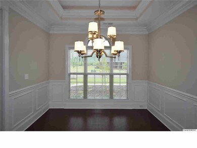 STUNNING FORMAL DINING ROOM WITH TREY CEILING, ROPE LIGTING AND HARDWOOD FLOORS.