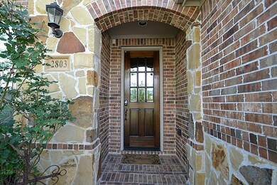 Front doorway with stone accents inviting you inside.