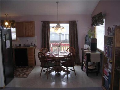 Dining Room w/ Entry to Wood Deck & Back Yard