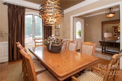 Large dinning room can easily accommodate a large group.  New modern chandelier.  