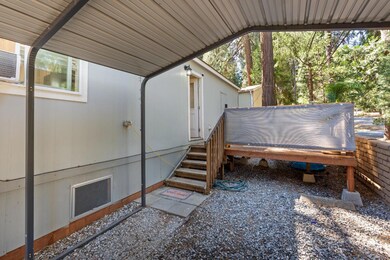 Carport large enough for two cars with direct access to home and deck.