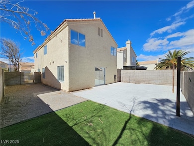Back of house with a fenced backyard, a tile roof, a patio, and stucco siding