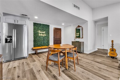 Dining room featuring light wood-type flooring, ba