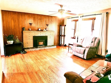 Living Room - hardwood floors -stone fireplace