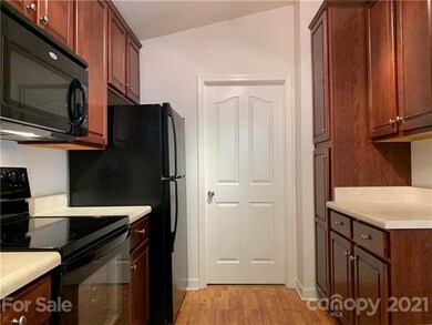Laundry room is off the kitchen.