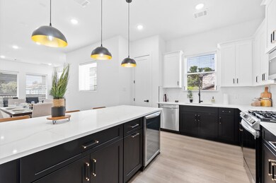 Modern kitchen with sleek black and white cabinetr