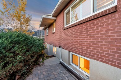 Property exterior at dusk featuring brick siding