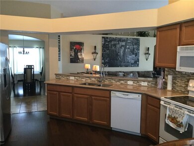 Beautiful glass backsplash open to Great Room
