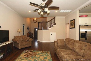 Second view of family towards entry.  Wood hand ra