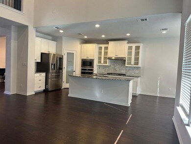 Kitchen featuring stainless steel appliances, tas