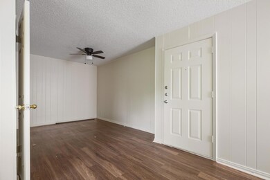 Unfurnished room with a textured ceiling, a ceili