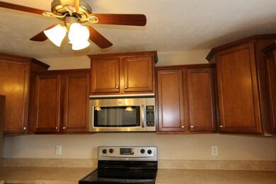 The crown-topped cathedraled cabinets and pantry o