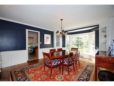 Lovely dining room with paneled wainscoting, built