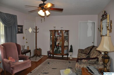 Front door on the left, and coat closet and a hallway to bedrooms and bathrooms