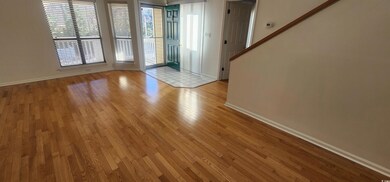 Entrance foyer with light hardwood / wood-style fl