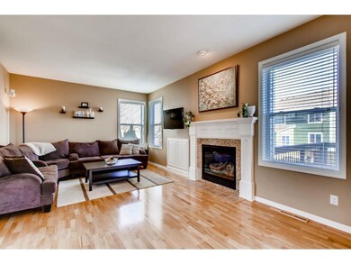 The family room offers a cozy gas fireplace with s