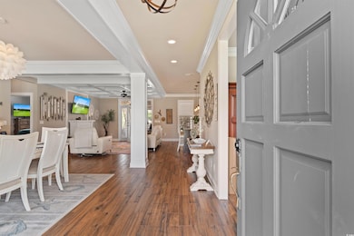 Entryway featuring crown molding, recessed lighting, a ceiling fan, dark wood finished floors, and baseboards