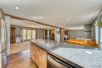 Kitchen featuring a textured ceiling, appliances w