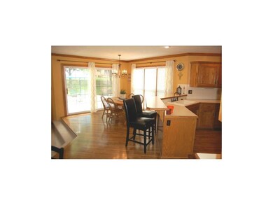 Newly refinished Hardwood Floors in this open kitc
