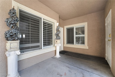 View of exterior entry with stucco siding