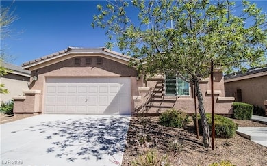 Single story home featuring driveway, an attached