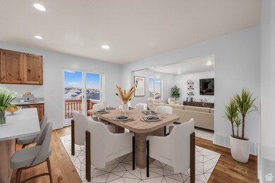 Dining space featuring light wood-style floors and recessed lighting