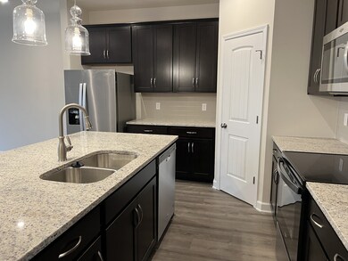 This is a photo of one of our model homes. Please know that some of the exterior and interior finishes, paint, and amenities may vary.