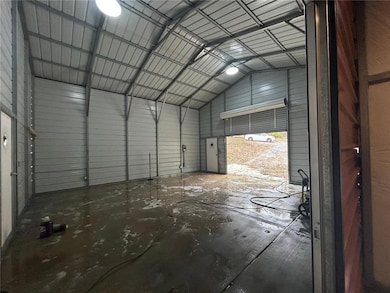 Garage featuring metal wall