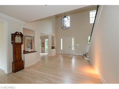 Bright and inviting 2 story foyer with white oak f
