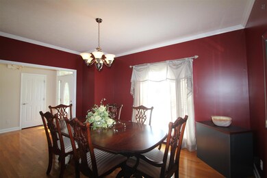 Formal dining room is just off of the kitchen and features hardwood floors. 