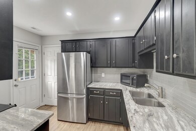 the kitchen has modern, stainless steel appliances.