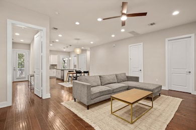 Living room featuring recessed lighting, dark woo