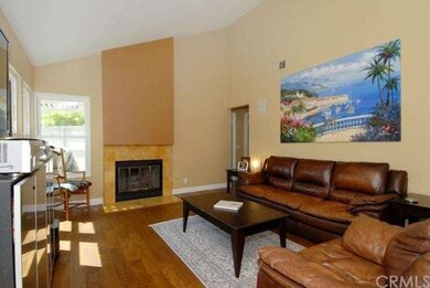 Refaced Fireplace, Wood Floors, High Baseboards