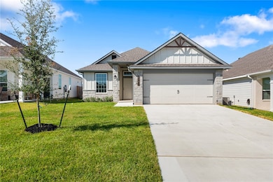 View of front of house featuring stone siding, board and batten siding, driveway, a front lawn, and a garage