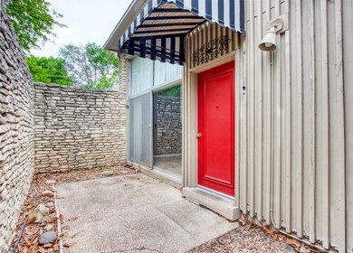 Doorway to property featuring a patio