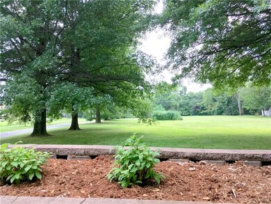 TREE LINED DRIVEWAY AND NEW RETAINING WALL LINE TH